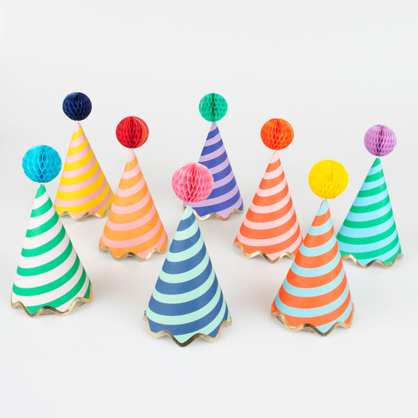 Our party accessories include hats with stripes and pompoms for a fun look. Image1