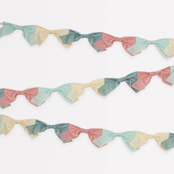 Our velvet bow fabric garland makes a special hanging decoration for a baby shower or bridal shower.