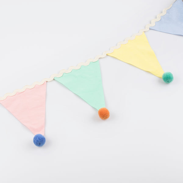 Add a pop of pastel color to your party table or wall with our flag garland with pompoms. Image4