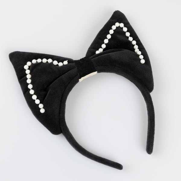Look purr-fect in this Halloween costume, a black skirt with a detachable cat tail and a black velvet cat ear headband. Image5