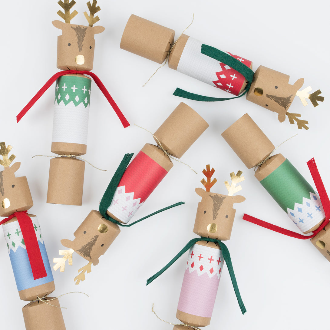 Our luxury Christmas crackers, with an adorable reindeer design, each contain a party hat, joke and a Christmas eraser or reindeer brooch.