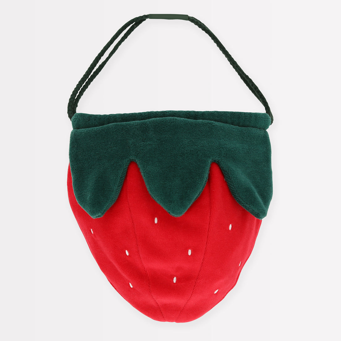 Our accessories for kids range includes a stunning strawberry bag crafted from soft velvet.