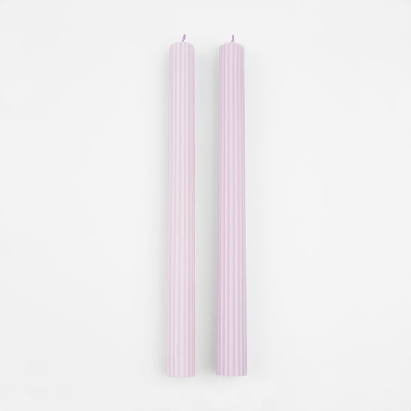 Our tall candles, in a lilac color, are perfect for any party with a purple theme. Image4