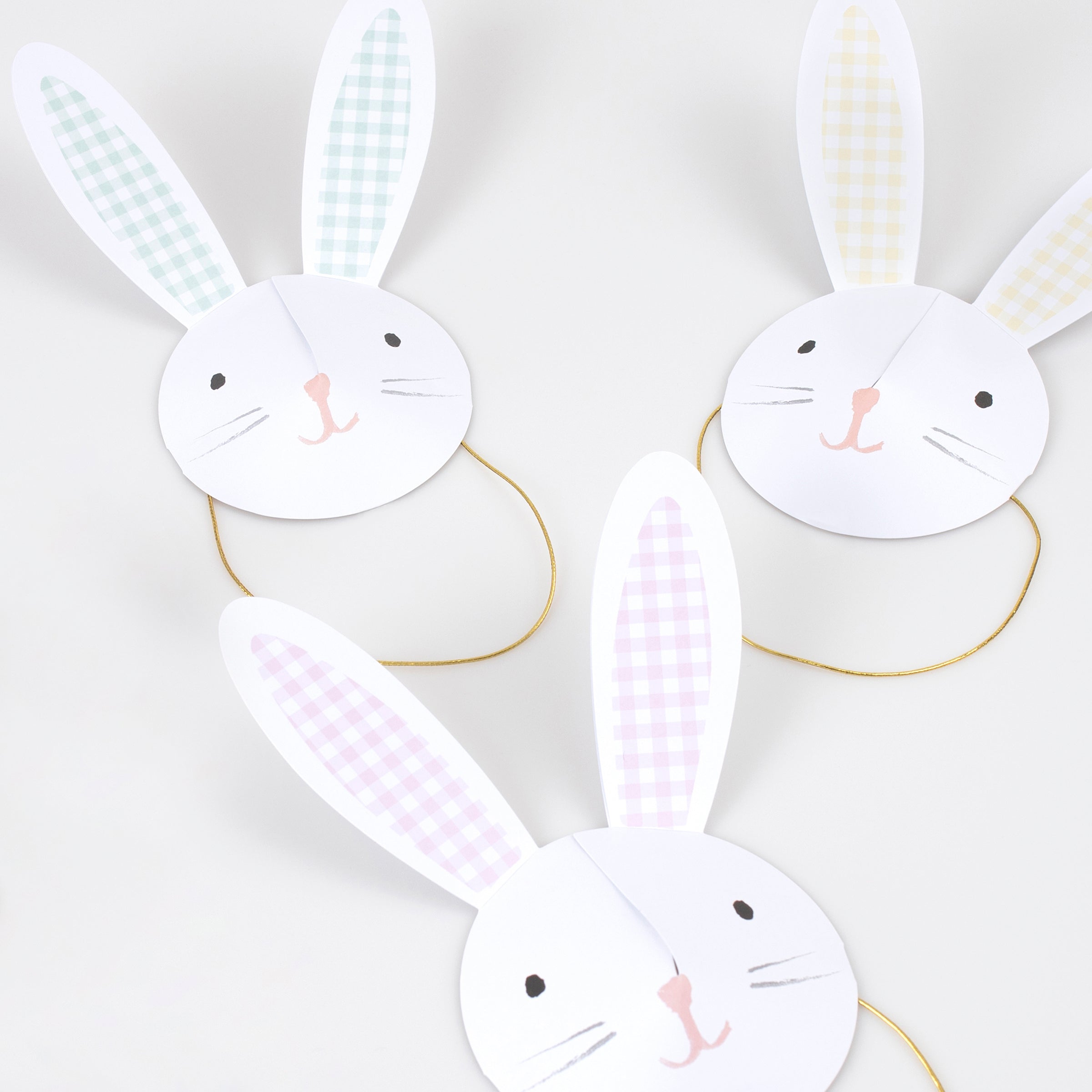 Our Easter hats feature adorable bunny ears and faces with on-trend gingham designs.