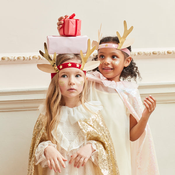 Our antler headbands, with velvet bands, shiny gold stars and antlers, and reindeer ears, make fun Christmas headwear. Image2