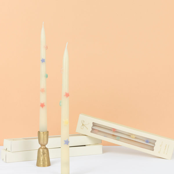 Our taper candles, with colored stars, will look great as table candles or on placed on the mantel. Image1
