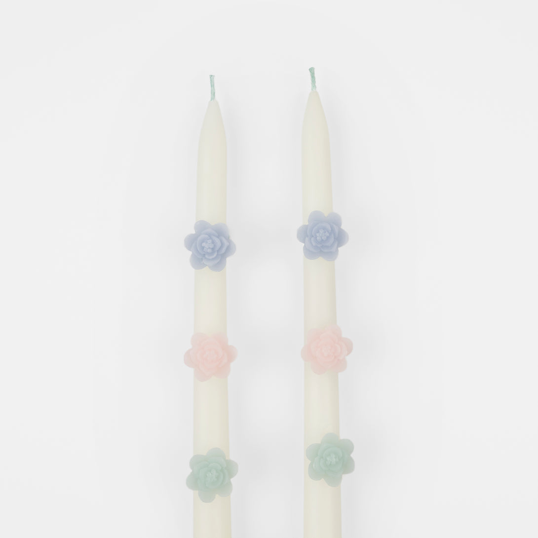 Our decorative candles are an elegant taper shape with 3D wax flowers.