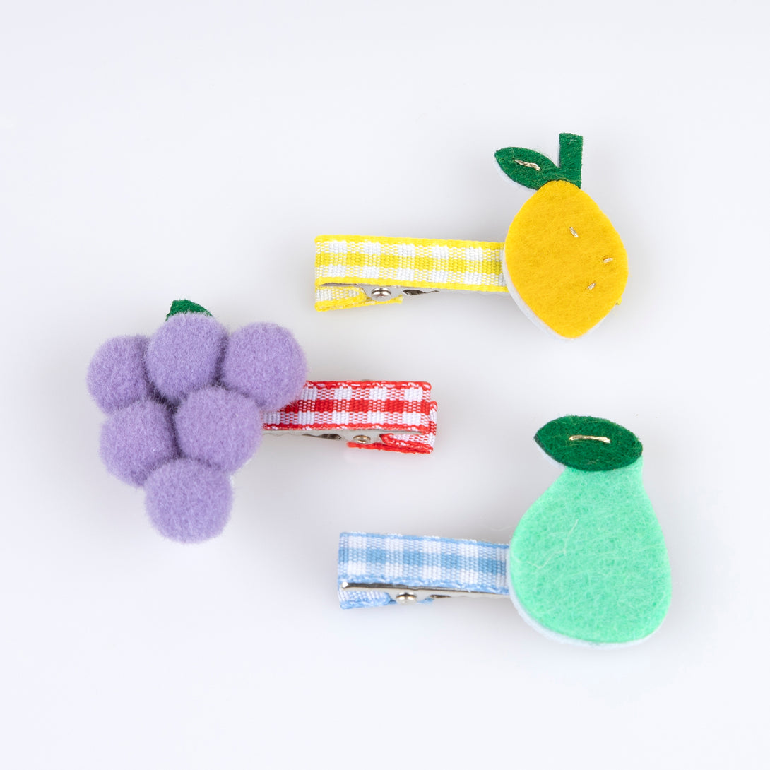 Our fruit hair clips are made from felt with fun pompoms and gingham ribbons for a really fabulous summery effect.