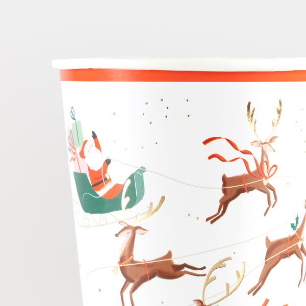 Serve hot or cold Christmas drinks in our paper party cups featuring a fun Santa design, ideal for kids and adults. Image2
