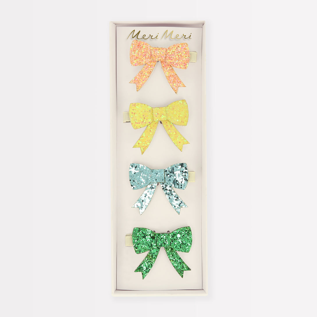 Our kids accessories range include glitter bow hair clips, perfect for a stylish look.