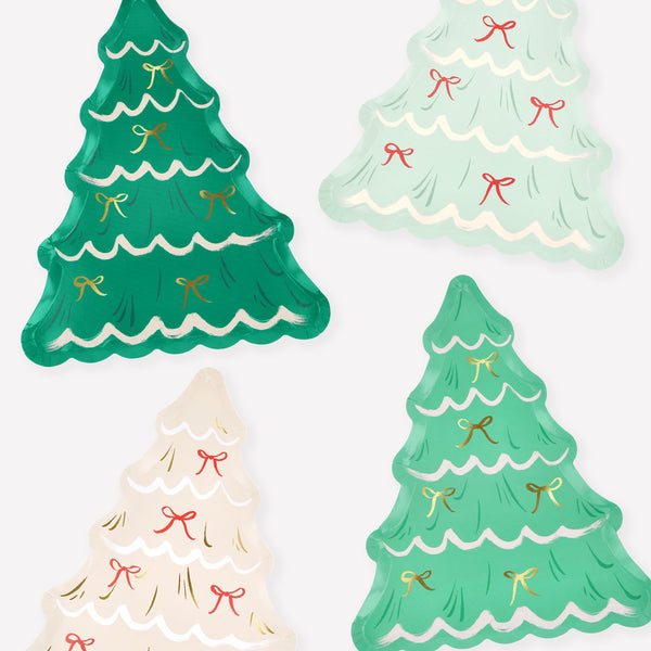 Our disposable Christmas plates, in the shape of Christmas trees with bows and gold foil details, will look amazing on your party table. Image1