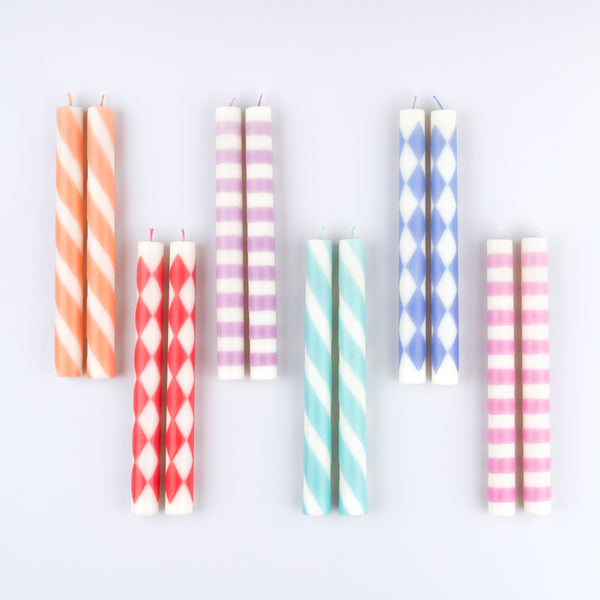 Add color and style to a table setting with a table candle. Our set of 12, in 6 colors and designs, is a wonderful candle gift too. Image2