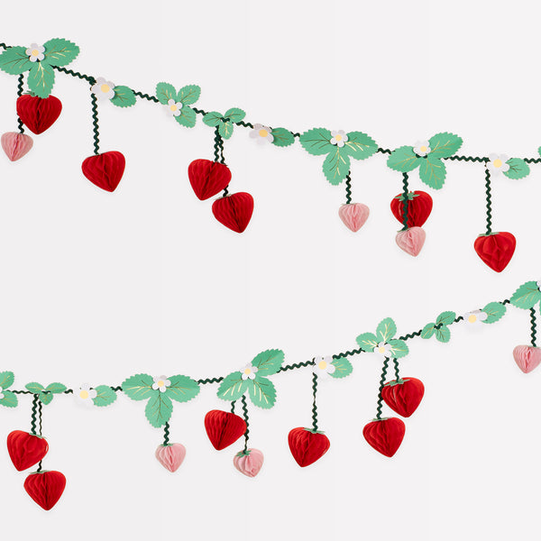 Our party garland has 3D strawberry pennants, with flowers, leaves and green ricrac ribbons, great as summer party decor. Image1