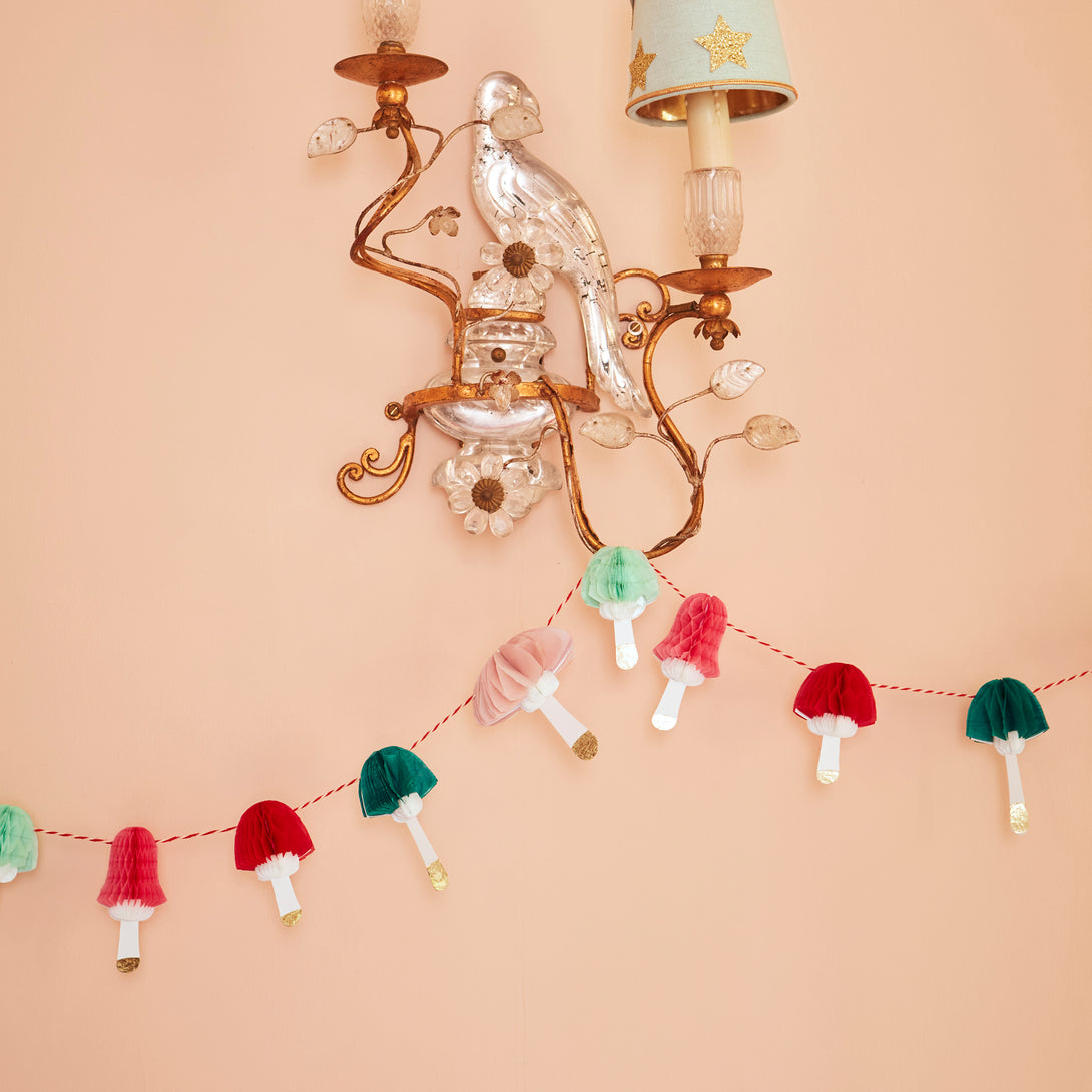 If you're looking for a Christmas wall decoration that's on trend then you'll love our mini paper garland with colorful mushrooms.