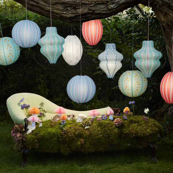 Decorate a room with our striped lanterns, crafted from paper with a pink cord for hanging. Image3