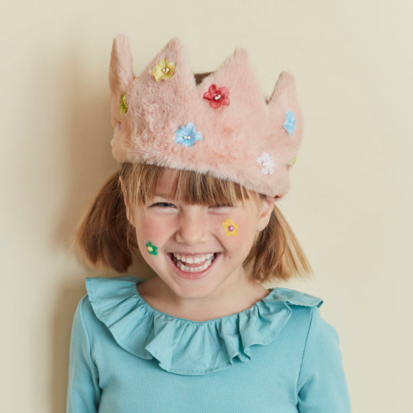Our pink crown is made from soft fabric and has sparkling flower sequins.