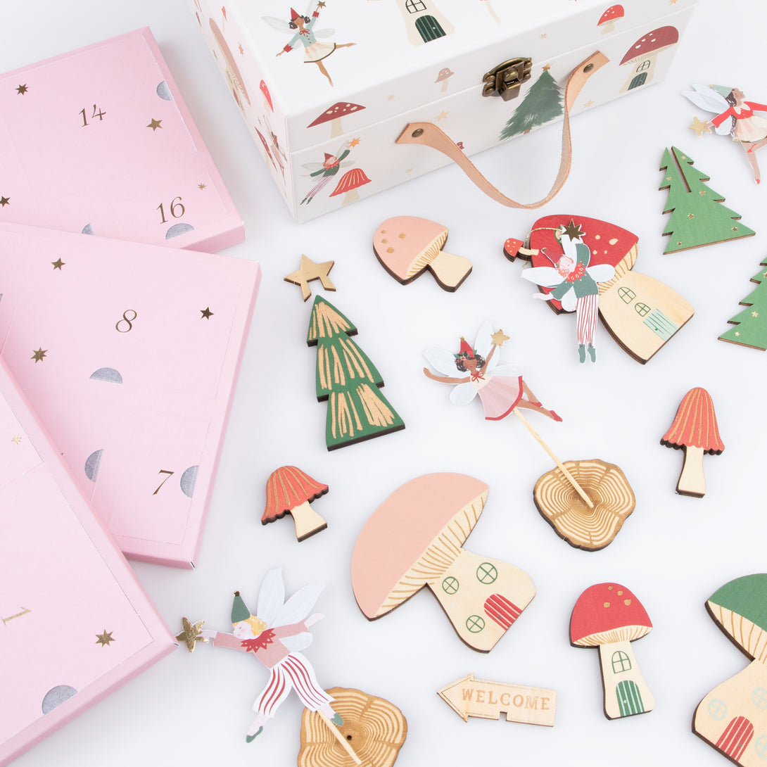 Our wooden advent calendar contains a woodland scene complete with paper fairies, presented in a suitcase, a fun interactive gift