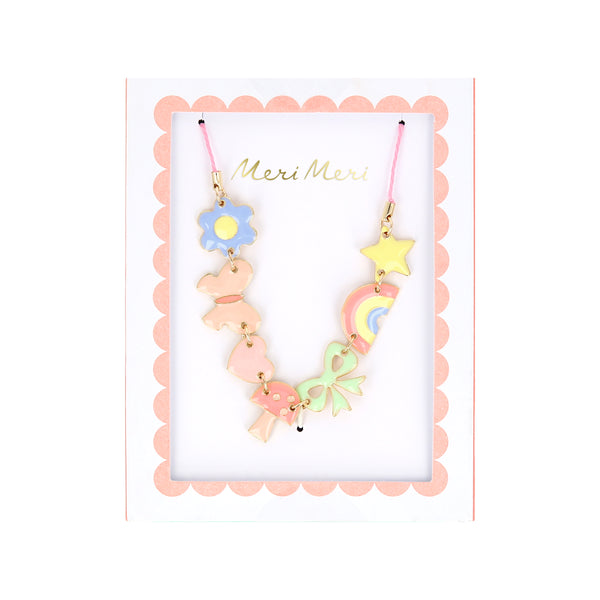 Our charms necklace is crafted with colorful enamel charms with a pink cord and gold tone lobster clasp, a pretty necklace for kids.