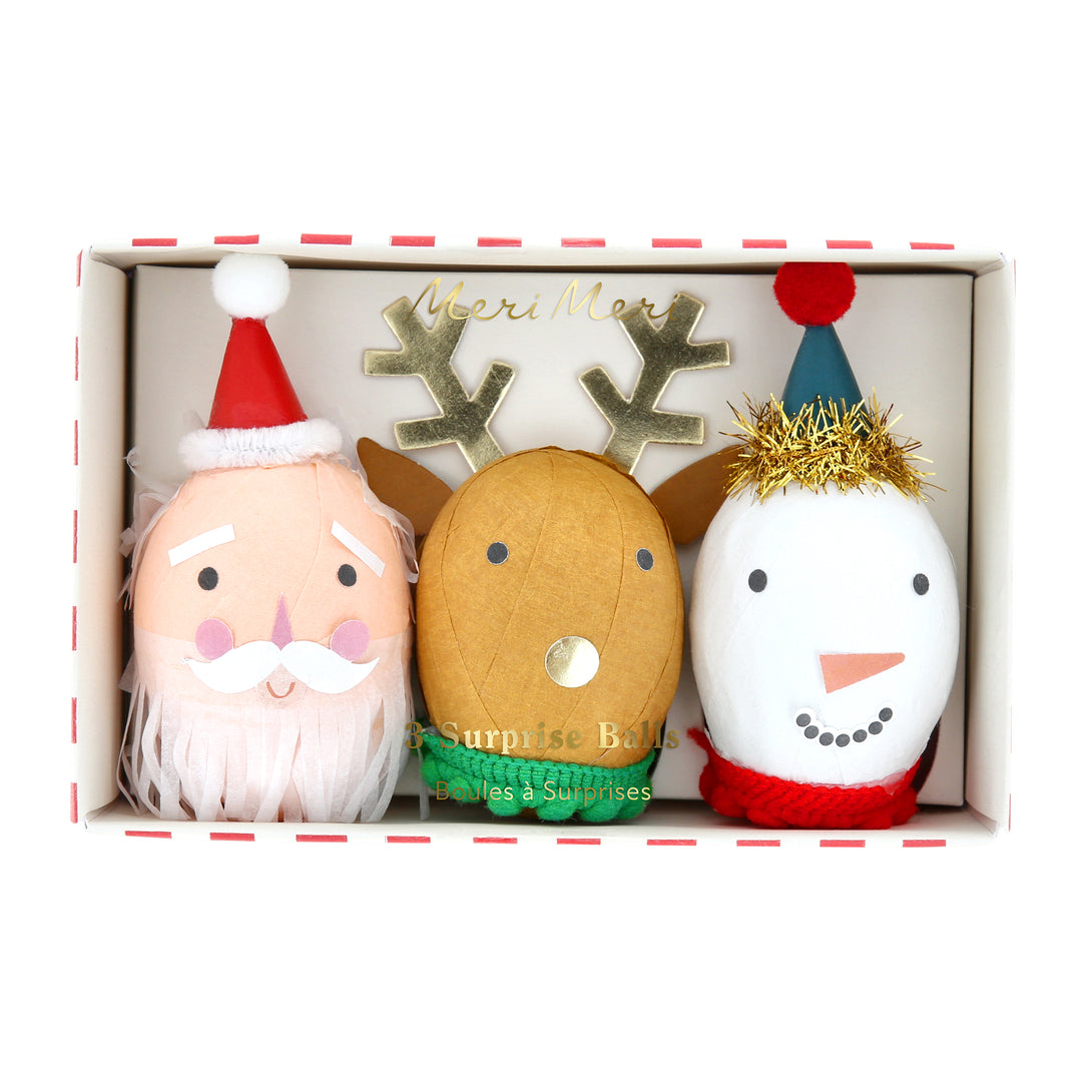 Our surprise balls, in the shape of Santa, a snowman and a reindeer, contain a gold party hat, 2 stickers, a joke and a fun eraser. Image5