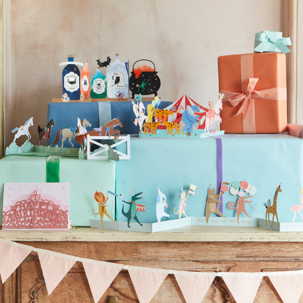 Our horse birthday card features horses, ribbons, tassels and a jump, and makes a great decoration for a horse party. Image2