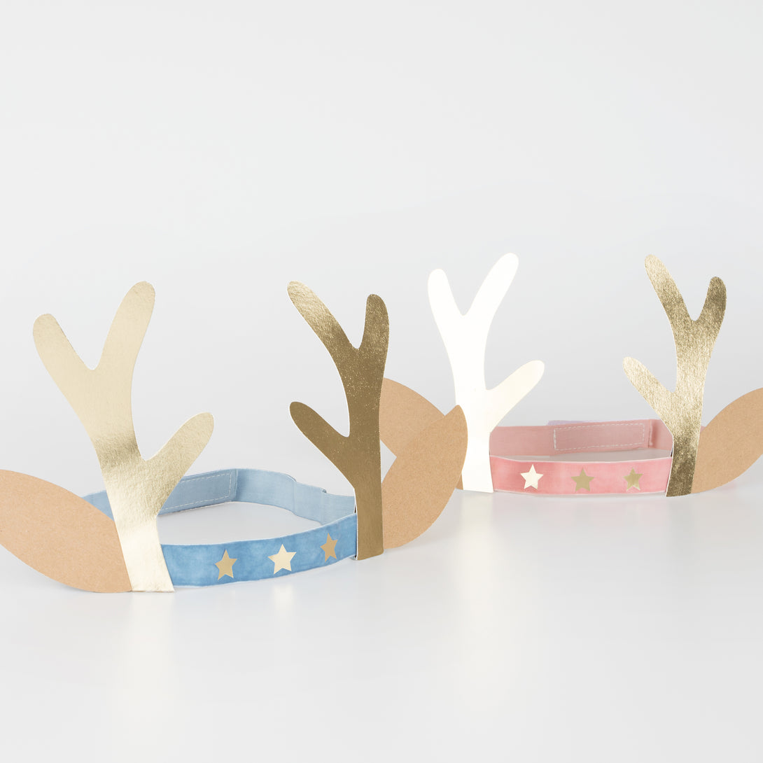 Our antler headbands, with velvet bands, shiny gold stars and antlers, and reindeer ears, make fun Christmas headwear.