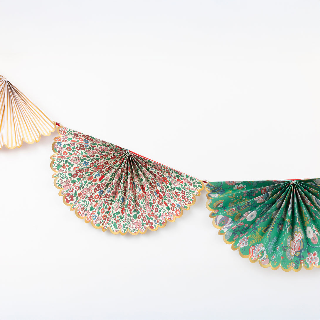 Our elegant Christmas garland has Liberty prints and matte gold foil details, pre-threaded on to a stylish red velvet ribbon. Image3