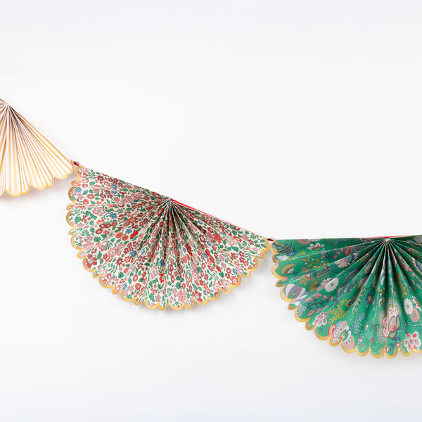 Our elegant Christmas garland has Liberty prints and matte gold foil details, pre-threaded on to a stylish red velvet ribbon. Image3