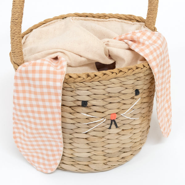 This basket is crafted from woven straw, with floppy ears, a sweet bunny face and a dellightful pompom tail. Image4
