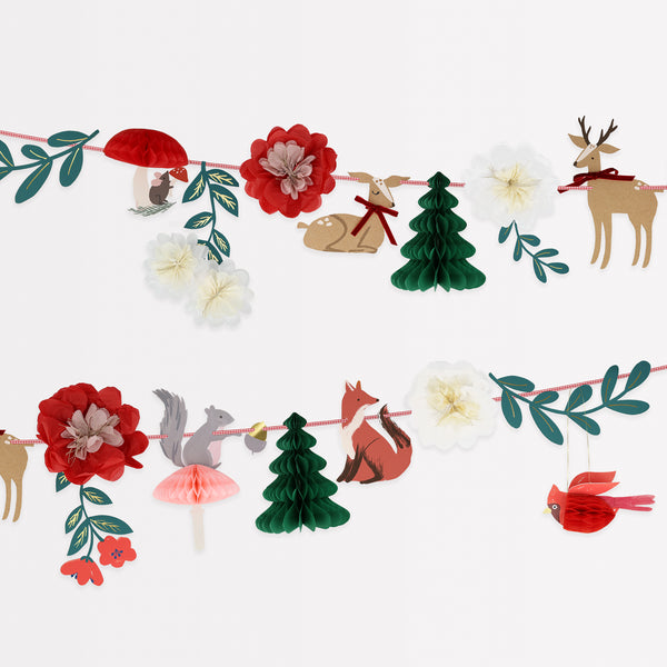 Our Christmas paper garland has traditional colors of red and green, with woodlands animals, trees and flowers for a charming effect.