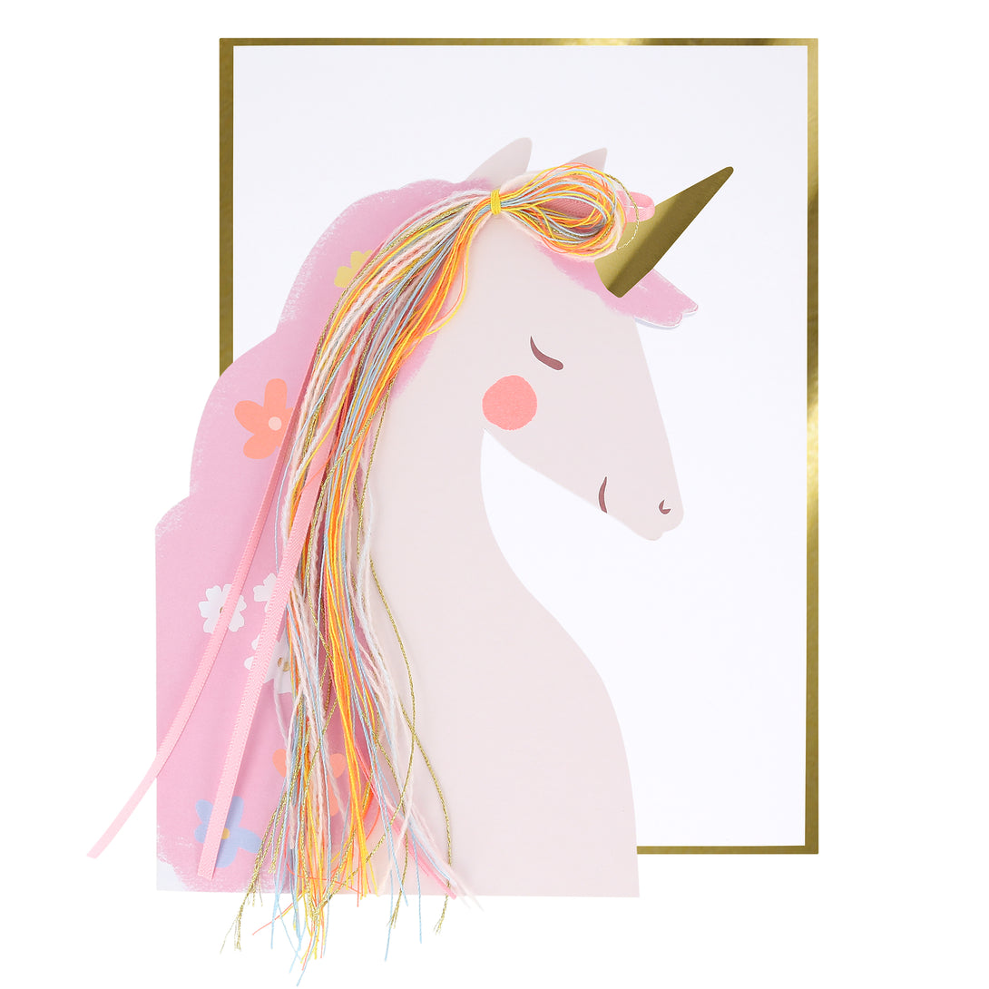 Our unicorn birthday card features a pretty unicorn with a mane made with sparkly thread, colorful yarn and light pink satin ribbon/