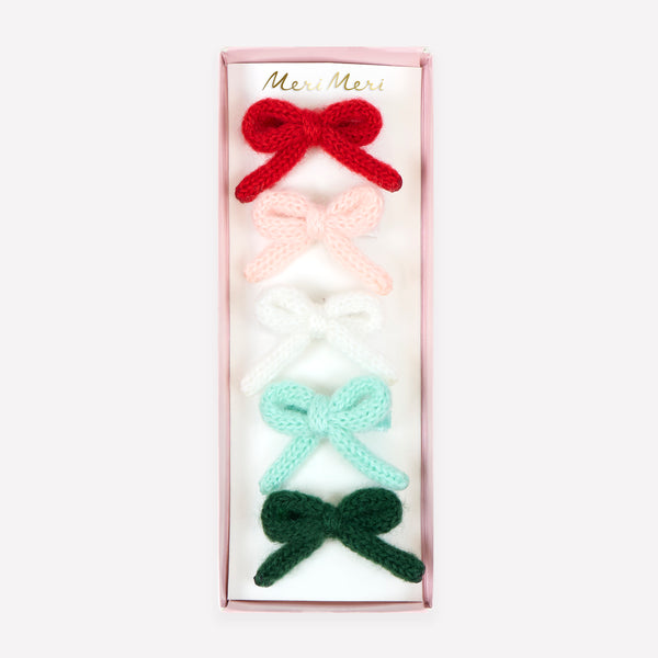 Our Christmas hair clips feature knitted bows and velvet ribbon details in red, pink, white, mint and green, for a wonderfully stylish look. Image1