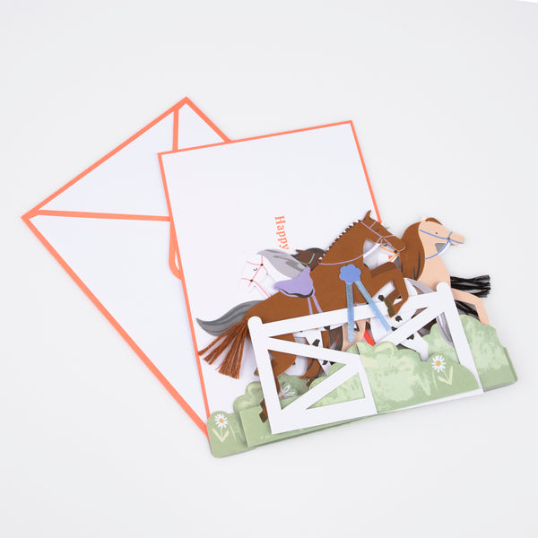 Our horse birthday card features horses, ribbons, tassels and a jump, and makes a great decoration for a horse party. Image5