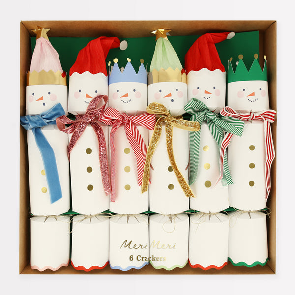 Our family crackers feature jolly snowmen with scarves and hat embellishments, and contain a joke, party hat and a fun eraser.