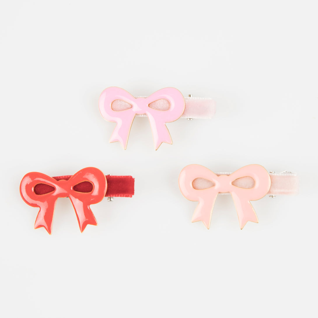 Our luxury red and pink hair clips feature enamel bows and velvet ribbons - the perfect Valentine's hair accessories for kids.