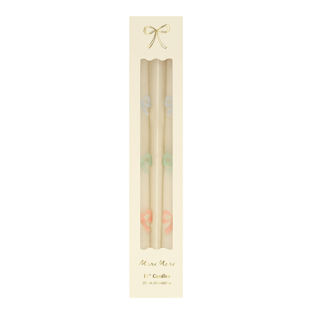 Our party candles, crafted in a tapered shape with embossed and handpainted pastel bows, have mint green wicks. Image5