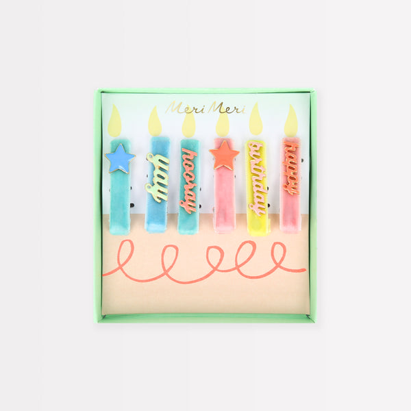 Our hair accessories for kids are charming birthday candle shaped clips with velvet ribbon and enamel details.