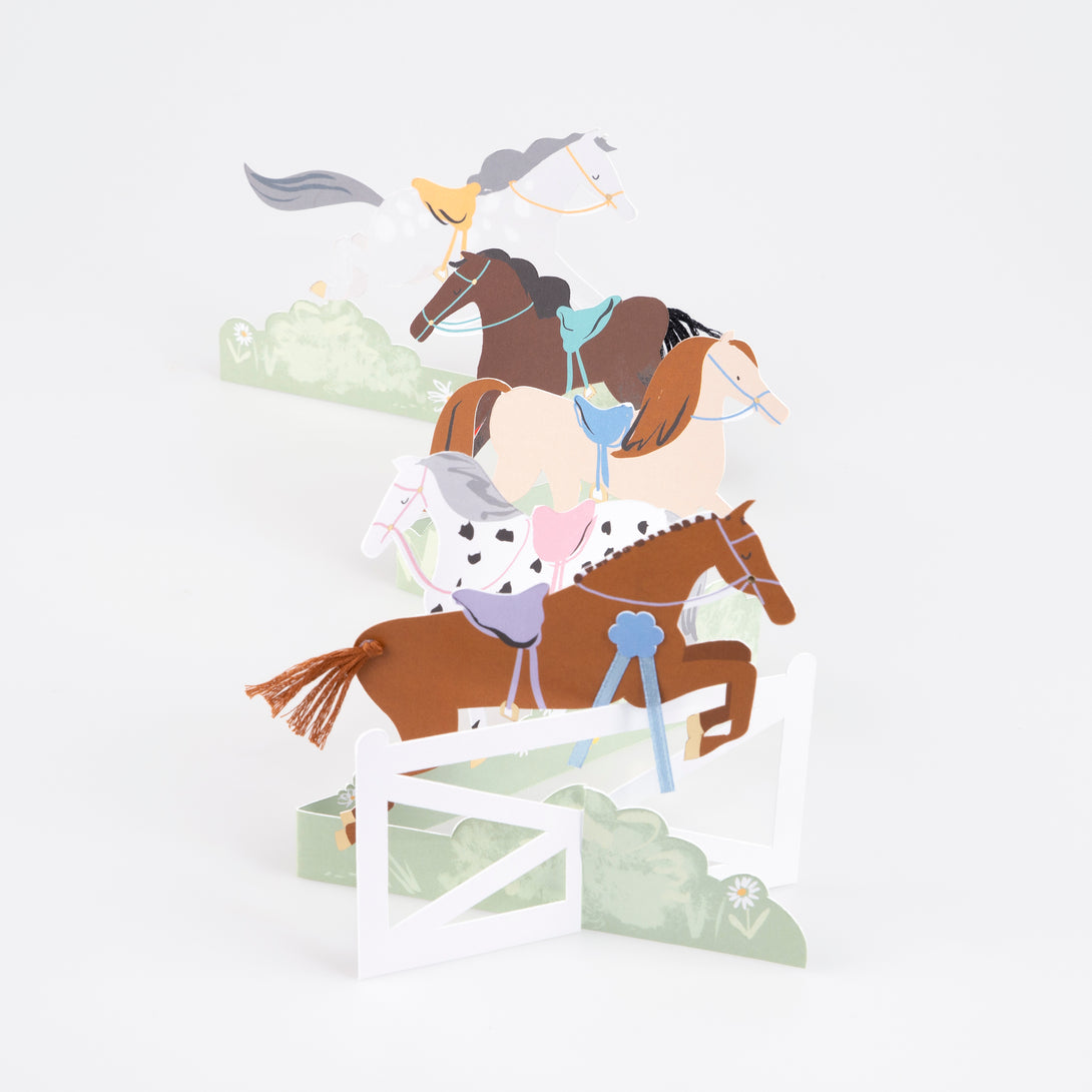 Our horse birthday card features horses, ribbons, tassels and a jump, and makes a great decoration for a horse party.