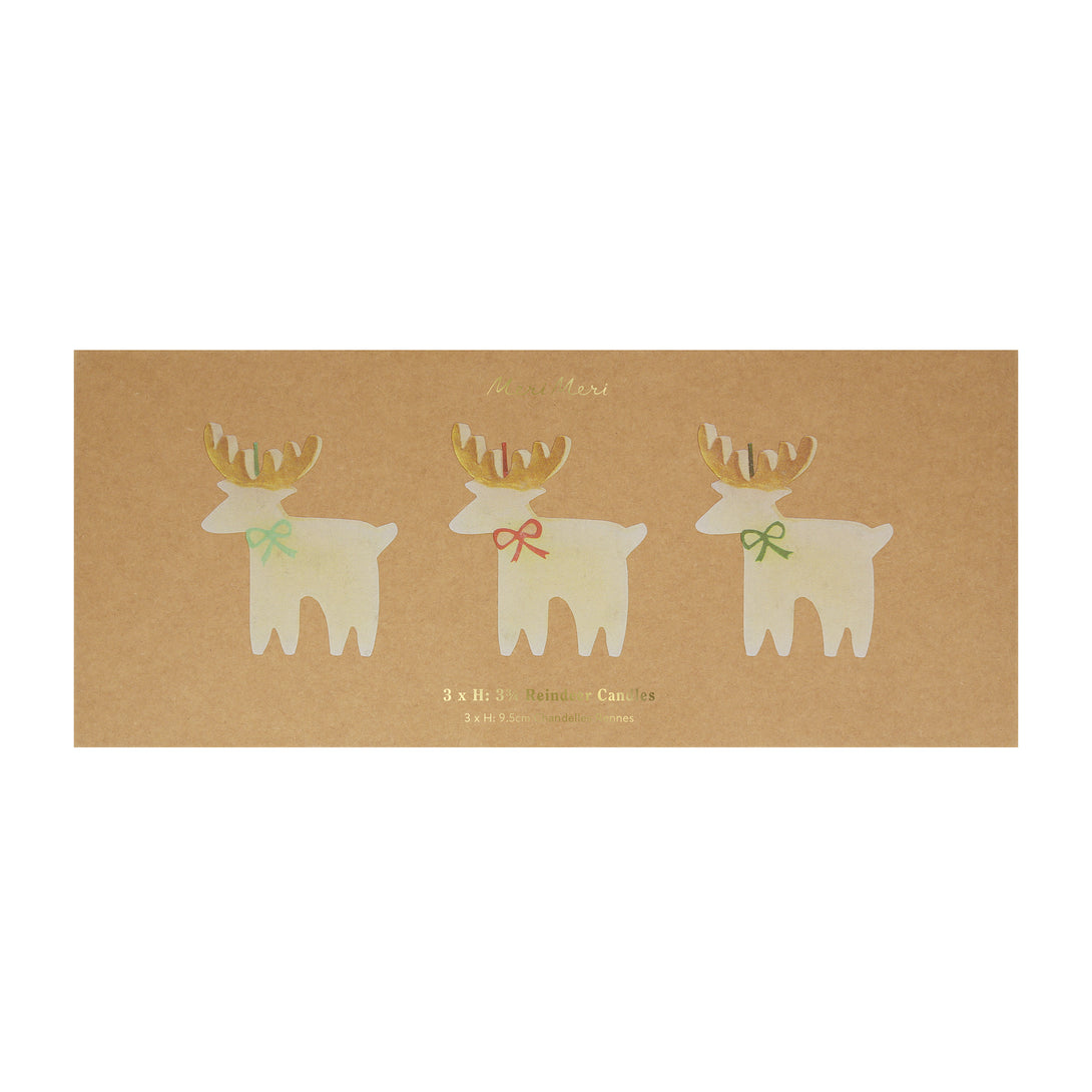 These Christmas table candles are reindeers with on-trend bows, gold details and fabulous colored wicks, a great host gift.