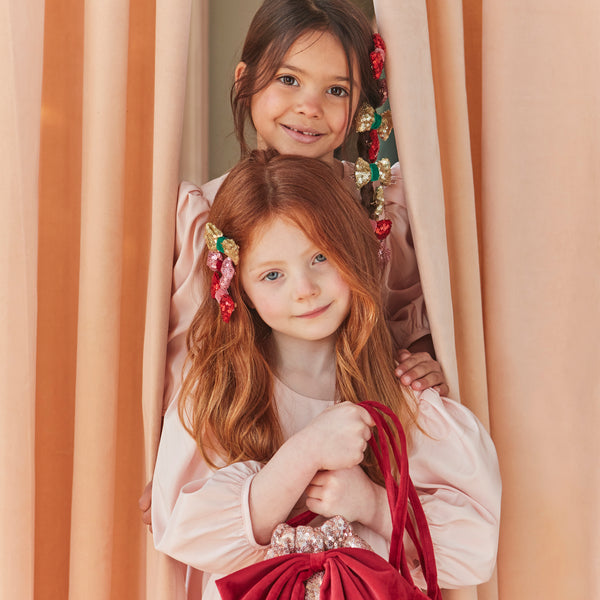 Accessorize your Christmas hairstyle with our sequin bows with velvet details, simply clip on for instant style. Image2