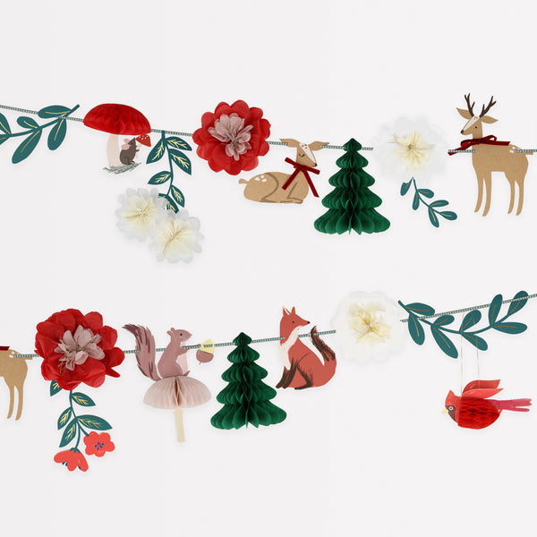 Our Christmas paper garland has traditional colors of red and green, with woodlands animals, trees and flowers for a charming effect.