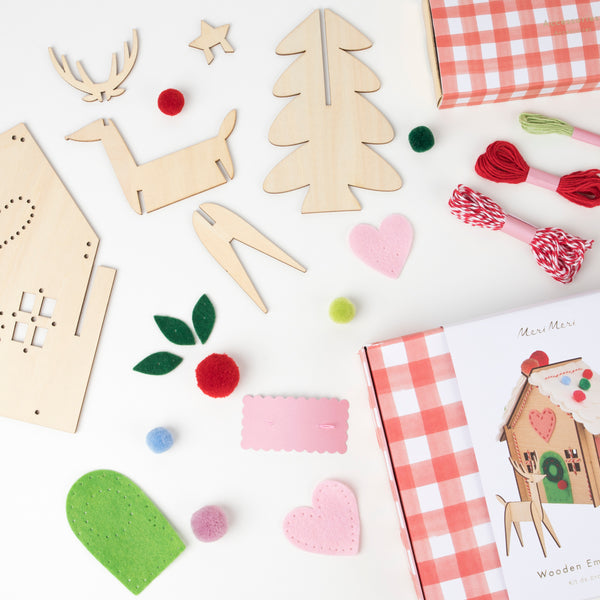 Our wooden gingerbread house features embroidery, felt and pompoms, with wooden reindeer. Perfect as a kids craft project. Image3