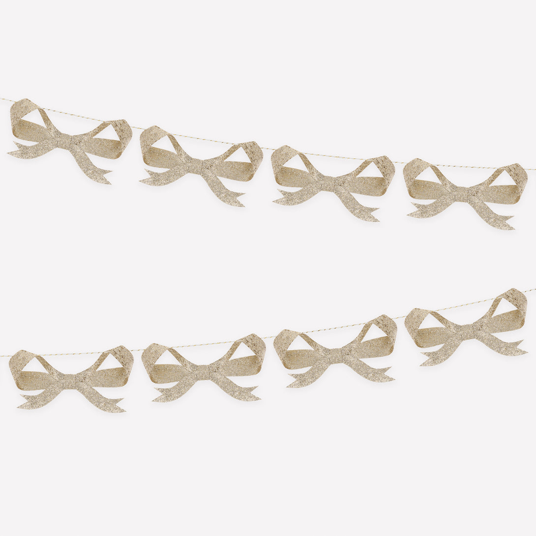Use our bow garland, with paper bows sprinkled with chunky gold glitter, for a fabulous festive look. Image1