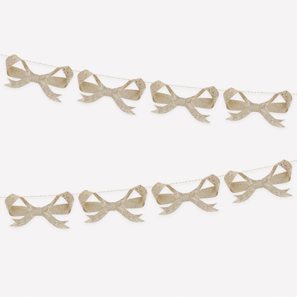 Use our bow garland, with paper bows sprinkled with chunky gold glitter, for a fabulous festive look. Image1