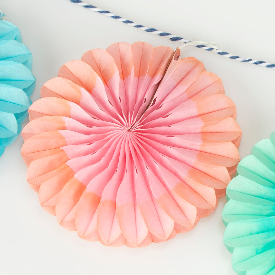 Our mini garland, with colorful honeycomb fans, is perfect to add decorations to any party.