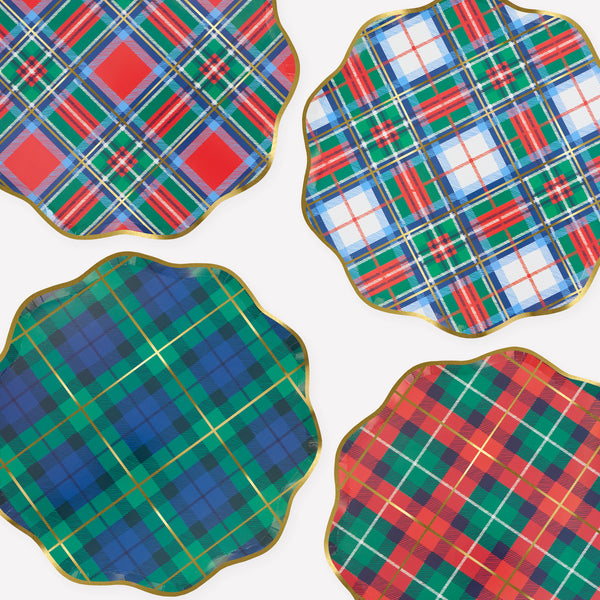 Our Christmas plates, made from paper in a dinner plate size, feature a mix of plaid designs in festive colors with pops of shiny gold foil. Image1