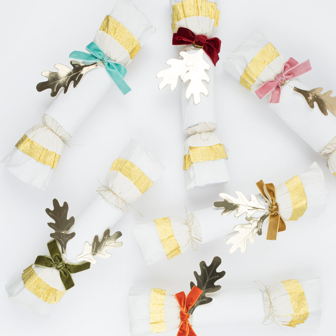 Our Thanksgiving crackers are made with crepe paper, golden leaves and velvet bows, and each have a luxury gift of a brooch or keyring.