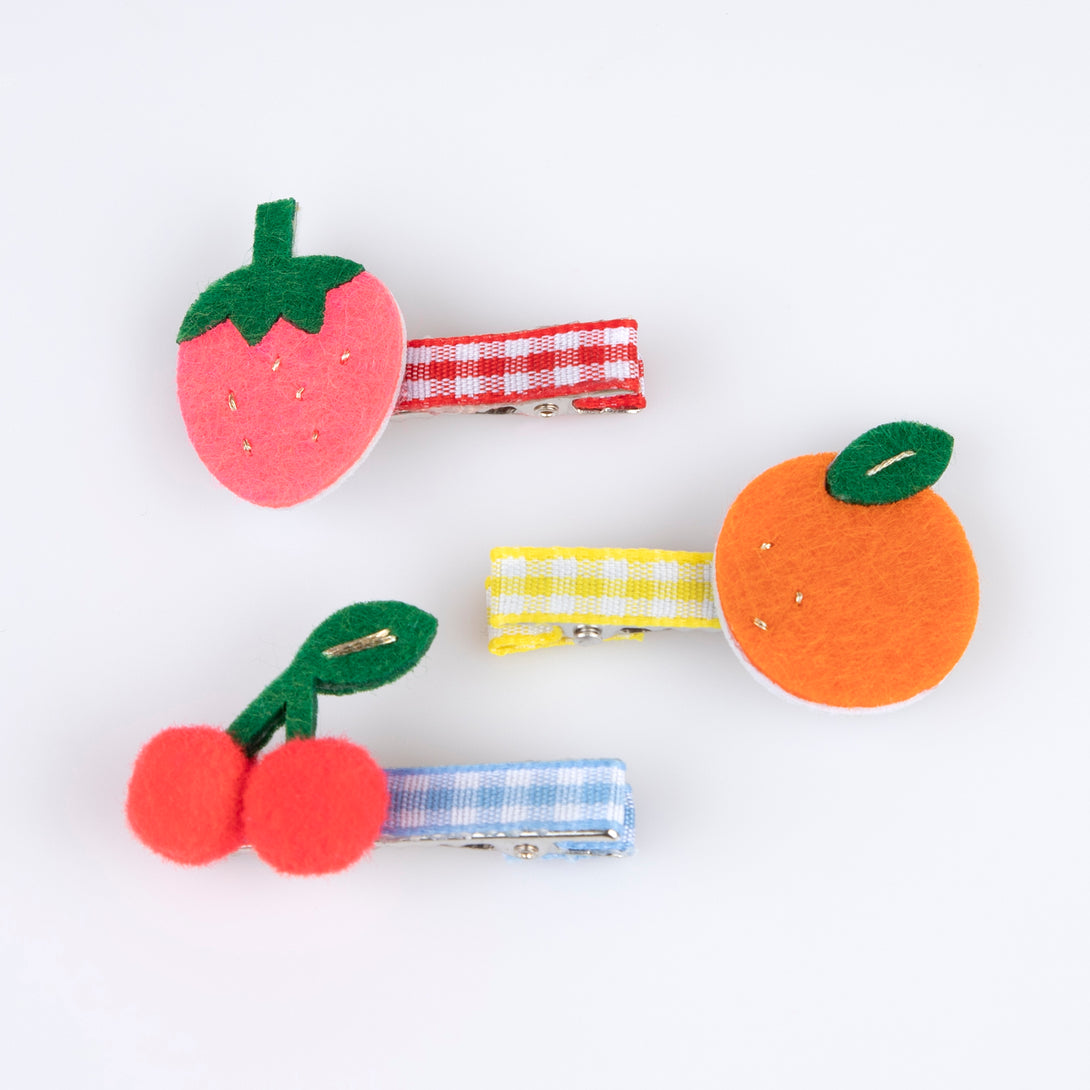 Our fruit hair clips are made from felt with fun pompoms and gingham ribbons for a really fabulous summery effect.