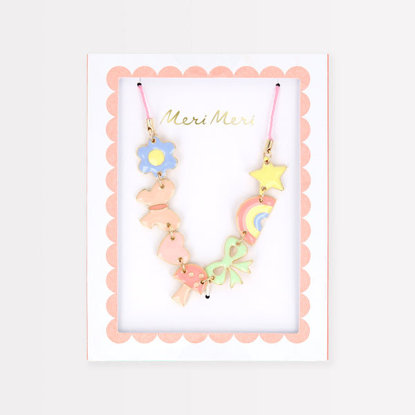 Our charms necklace is crafted with colorful enamel charms with a pink cord and gold tone lobster clasp, a pretty necklace for kids.