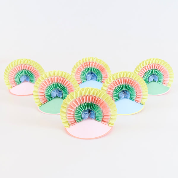 Swap plain hats for our rainbow party hats, ideal for a rainbow party, birthday or any special celebration for a stylish, fun look. Image1