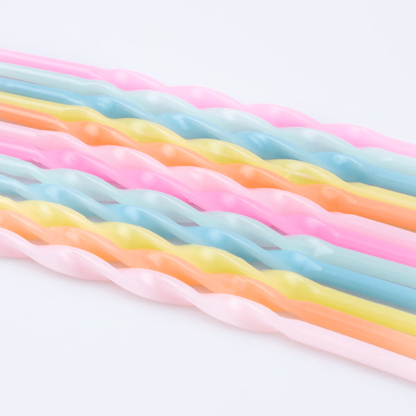 Our party candle set features pastel candles, in a twisted shape, packaged in a box with a Liberty print design. Image3